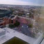 Birds eye view looking outside of hotel window at racers getting ready for the Baltimore Marathon