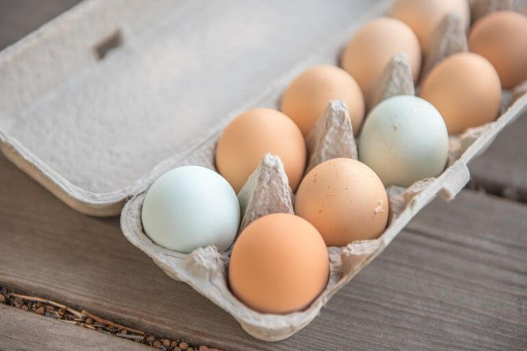A carton of white and brown eggs for an ingredient article about eggs and new egg products