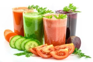 Fresh vegetable juices made from carrots, cucumber, tomato and beets for an article about functional ingestibles formulated for good health