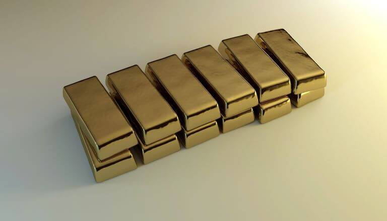 Two rows of six gold bars stacked for an ingredient article about how gold is used to communicate luxury