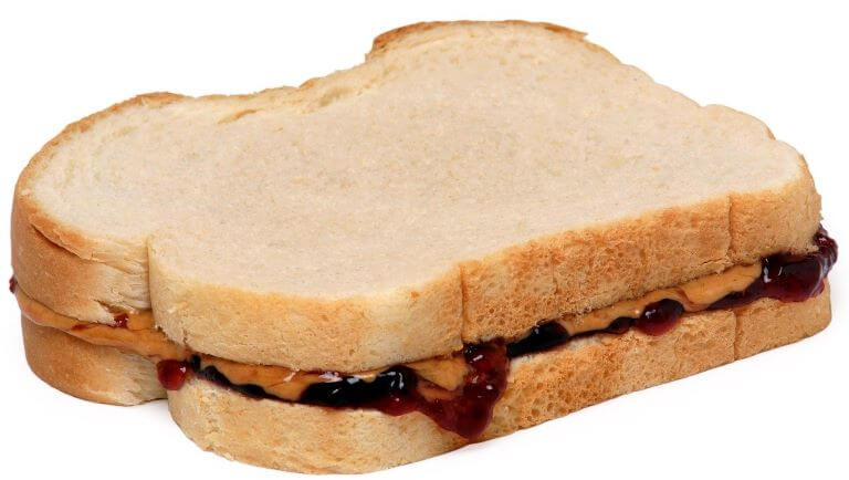 A close up of a peanut butter and jelly sandwich for an ingredient article about new PB&J products