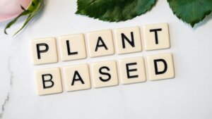 Plant Based spelled out with tiles for an article about new plant based milk ingredients and non dairy milk alternatives