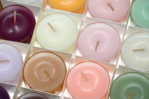 A box of colorful tealight candles for an article about new spring scented candle launches