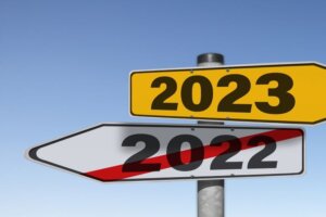 Trendincite LLC 2022 Trends In Review road sign with 2022 crossed out and 2023