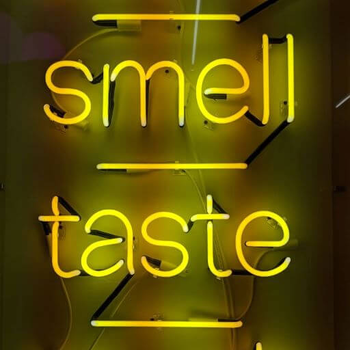 Smell and taste neon yellow sign for a food, beverage, beauty, and scented candle collaboration trend article